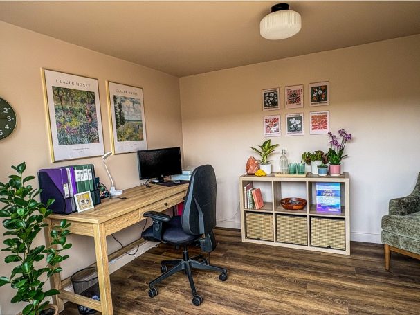 A wider room view Wider view of the Holmes Chapel therapy room with a desk, plants and storage
